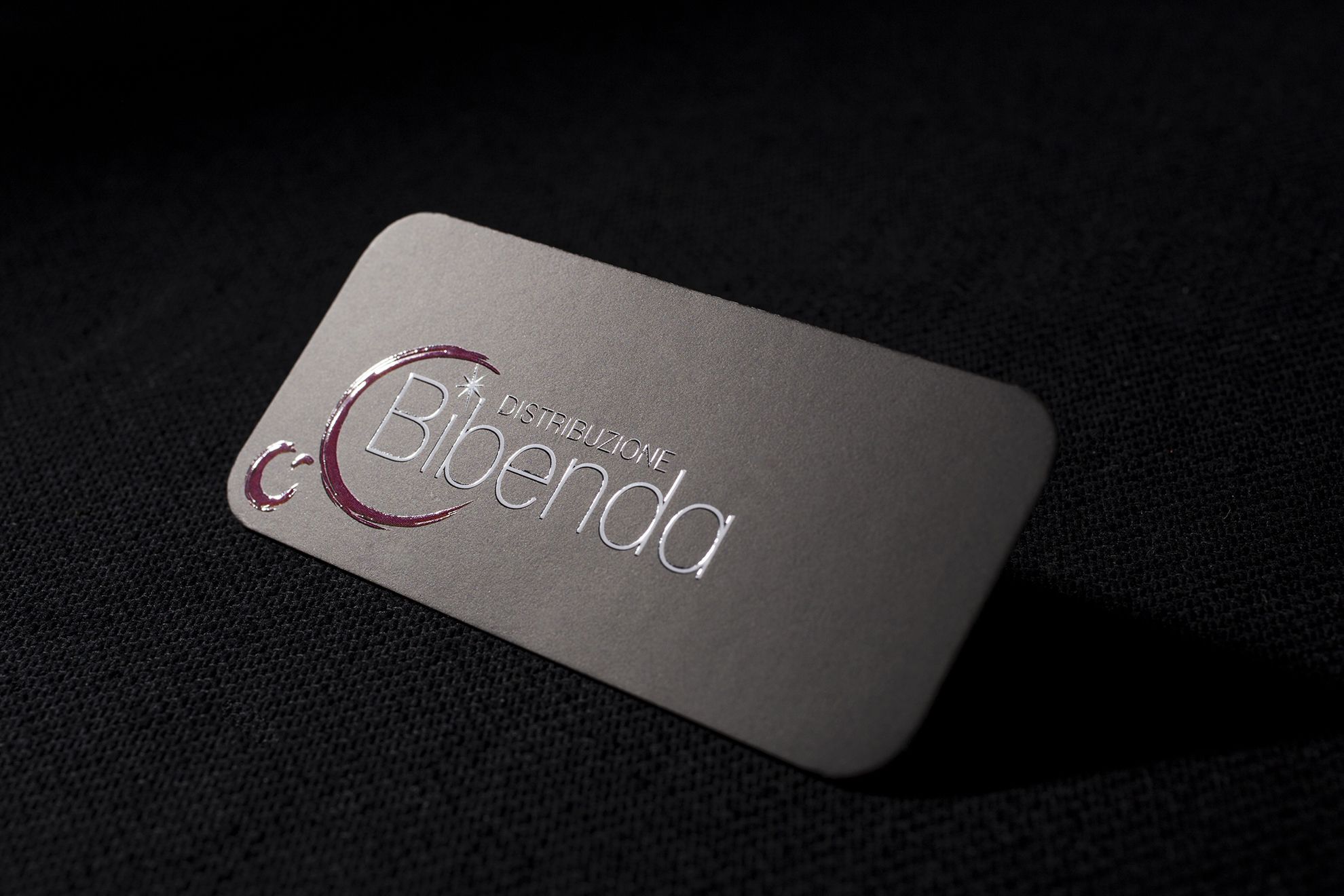Premium luxury business card with elegant silver finish and embossed branding for executives. Sprint24.