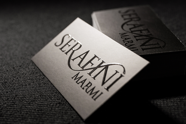 Classic UV business cards with elegant minimalist design in white and black for professionals. Sprint24.