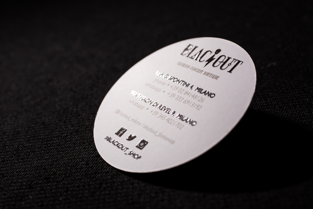 Oval die-cut business card Flacout bar Milan with black logo address and social icons. Sprint24.