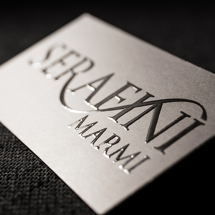 UV relief business card with embossed lettering and tactile depth for premium brand impression. Sprint24.